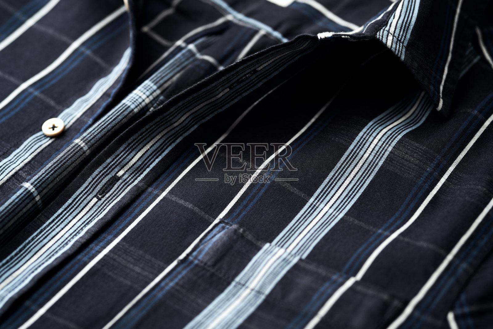 男士格子衬衫的特写。照片摄影图片