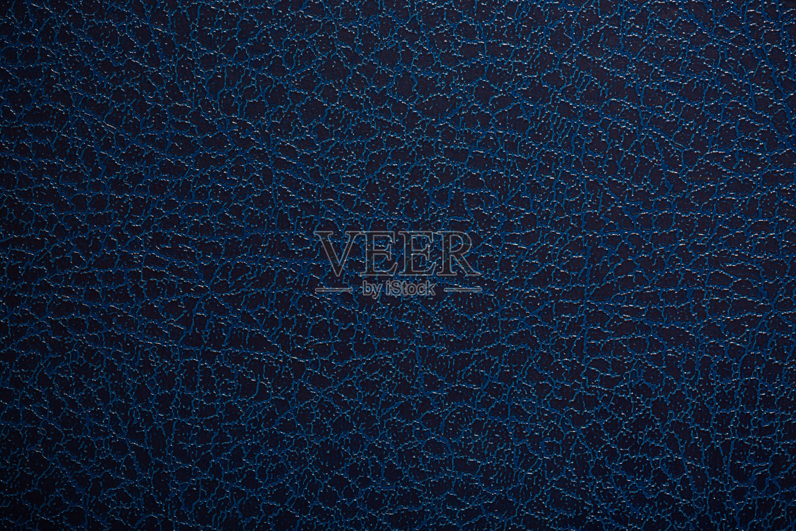 深蓝色纹理皮革背景。抽象皮革纹理。照片摄影图片