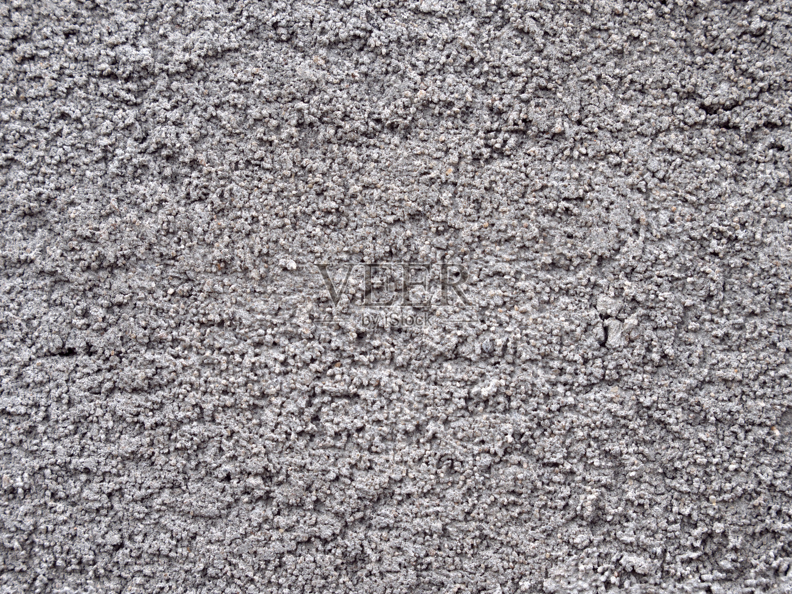 单色混凝土表面的结构。灰色墙面抹灰。照片摄影图片