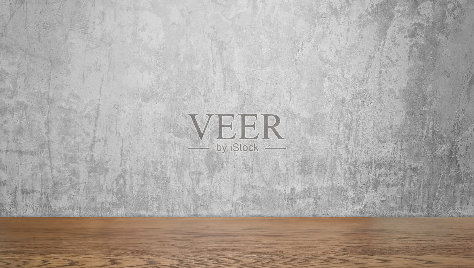 前景是胡桃木台面，背景是灰色混凝土墙。用于展示产品的真实台面图像。用于设计的粗糙混凝土墙和木桌。照片摄影图片