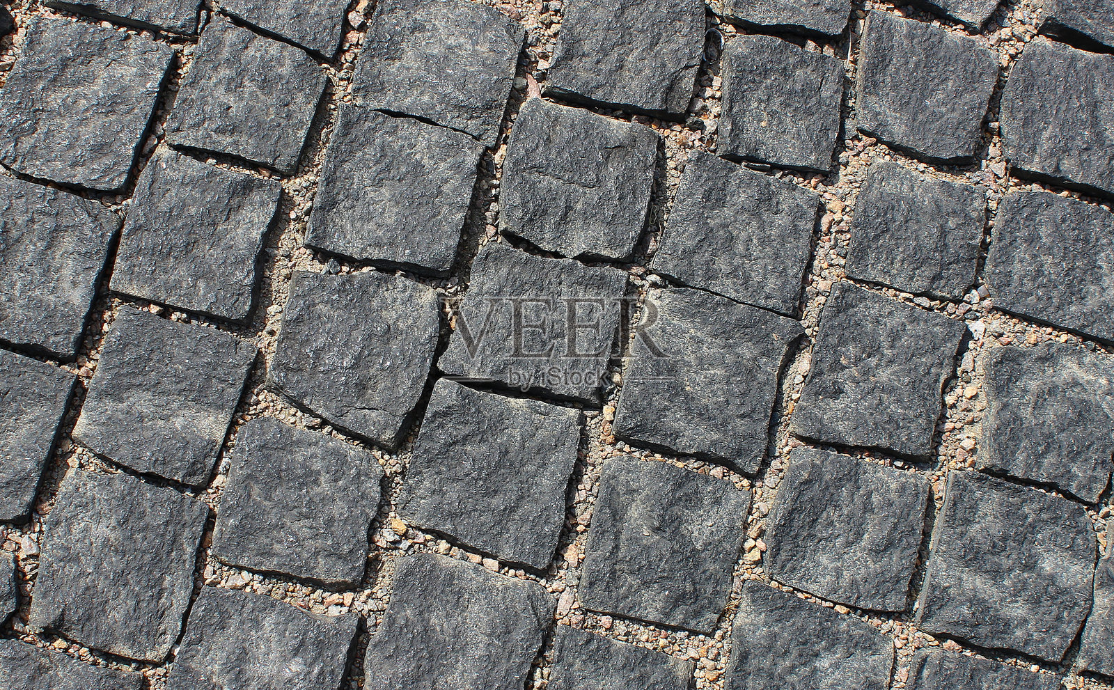 斜面立方体形状的深色粗糙卵石图案照片摄影图片