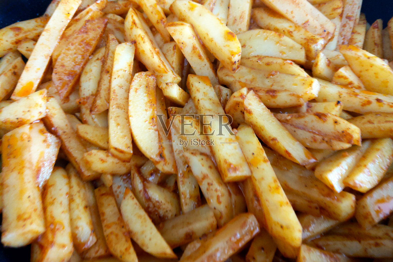 香辣调味薯条 - 适合小吃爱好者和烹饪爱好者照片摄影图片