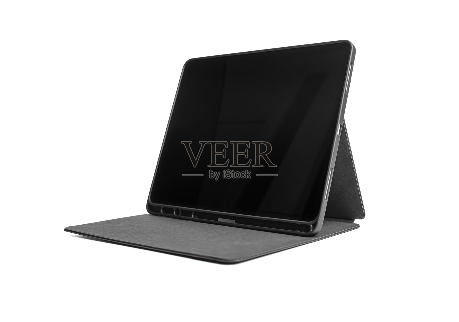 黑色平板电脑放在白色背景上的支架上。照片摄影图片