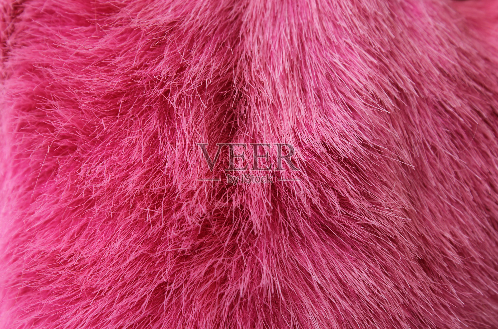 粉色人造毛绒布料抽象纹理背景照片摄影图片