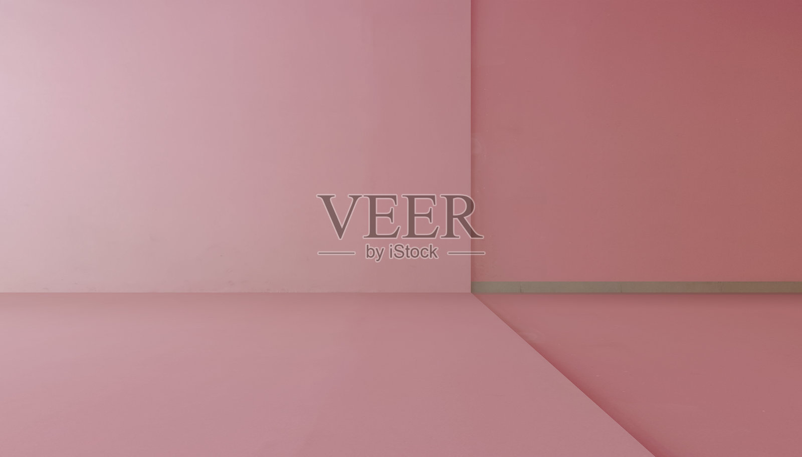 里面有一面空荡荡的粉色墙壁和地板。照片摄影图片