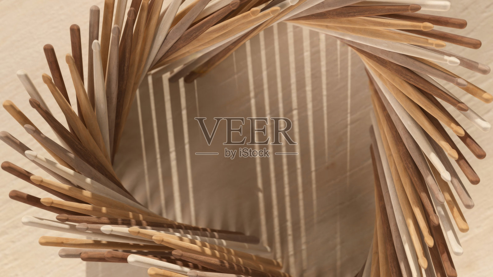 由不同棕色调的木棍构成的3D抽象螺旋渲染，在米色背景上投射出戏剧性的阴影照片摄影图片
