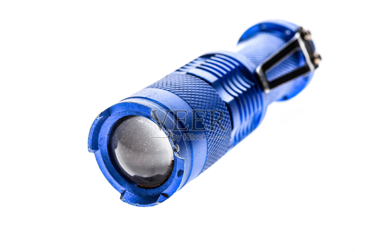 白色背景下的手电筒特写照片摄影图片