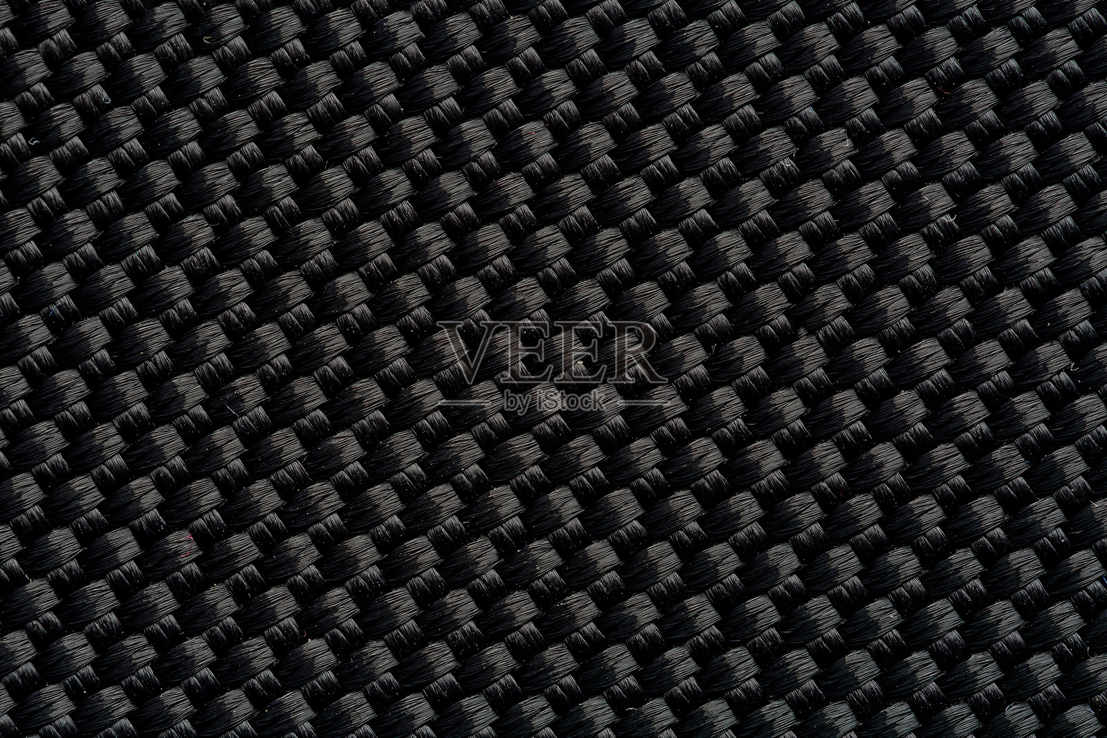 黑色织物纹理特写，黑灰色织物纹理适用于背景和设计艺术作品，具有自然纺织品的无缝图案。照片摄影图片