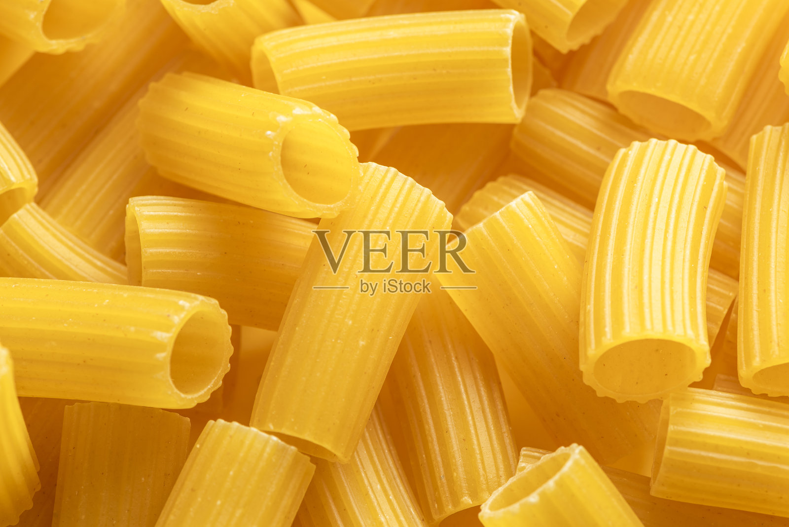 意大利干意面通心粉特写。食品背景。照片摄影图片