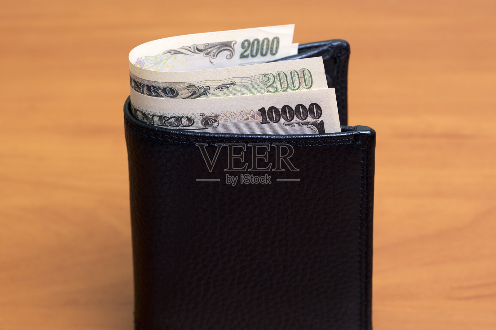 黑色钱包里的日元照片摄影图片