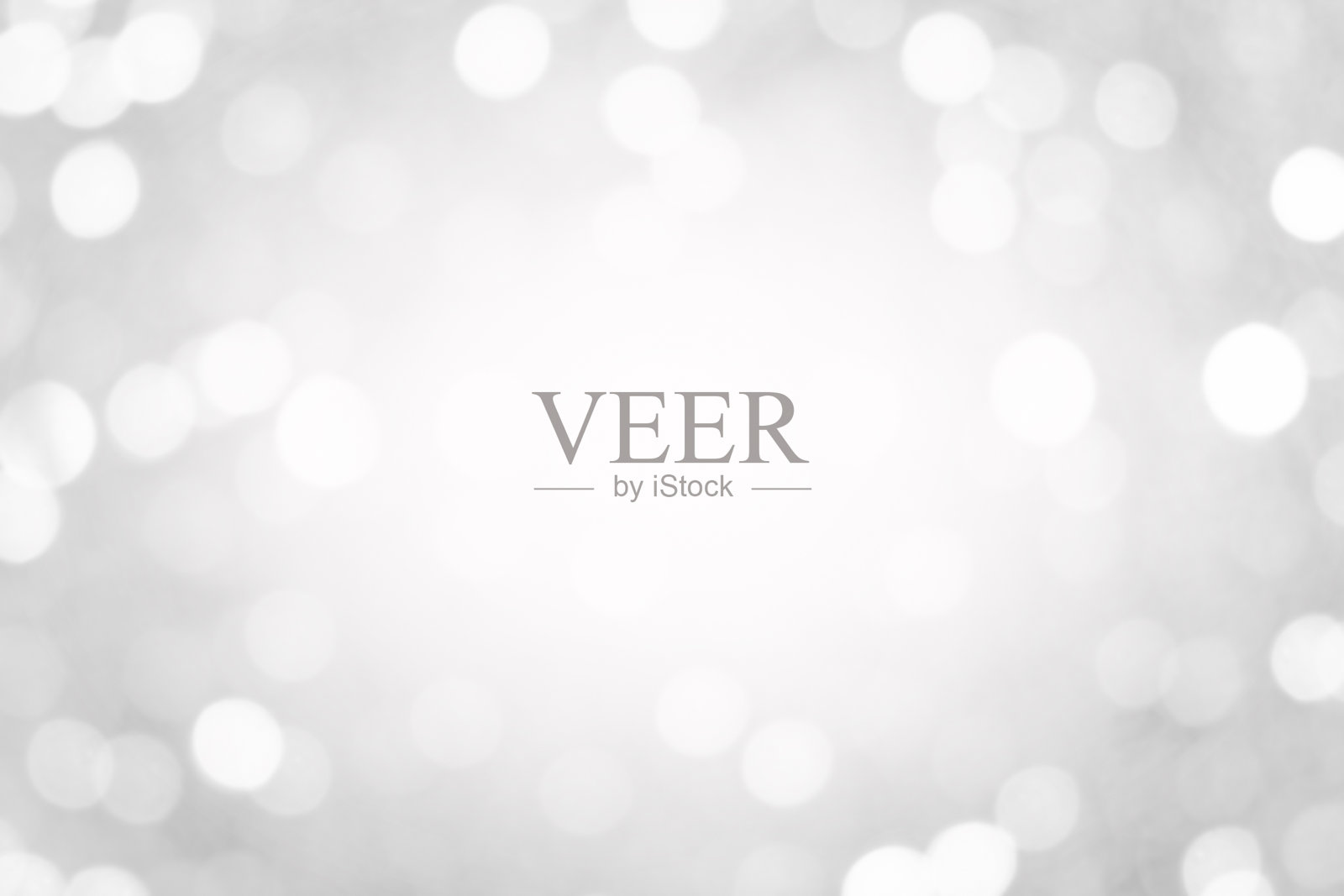 灰白色光斑背景是一种自然灰色的光影，模糊而美丽。照片摄影图片