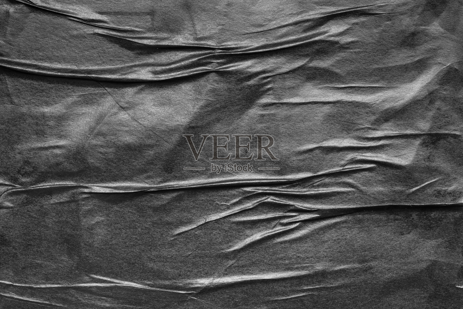 黑色皱褶和折痕纸张海报的粗糙纹理背景照片摄影图片