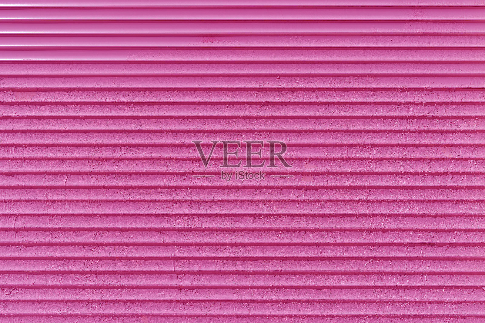 老旧粉色抹灰墙的纹理。照片摄影图片