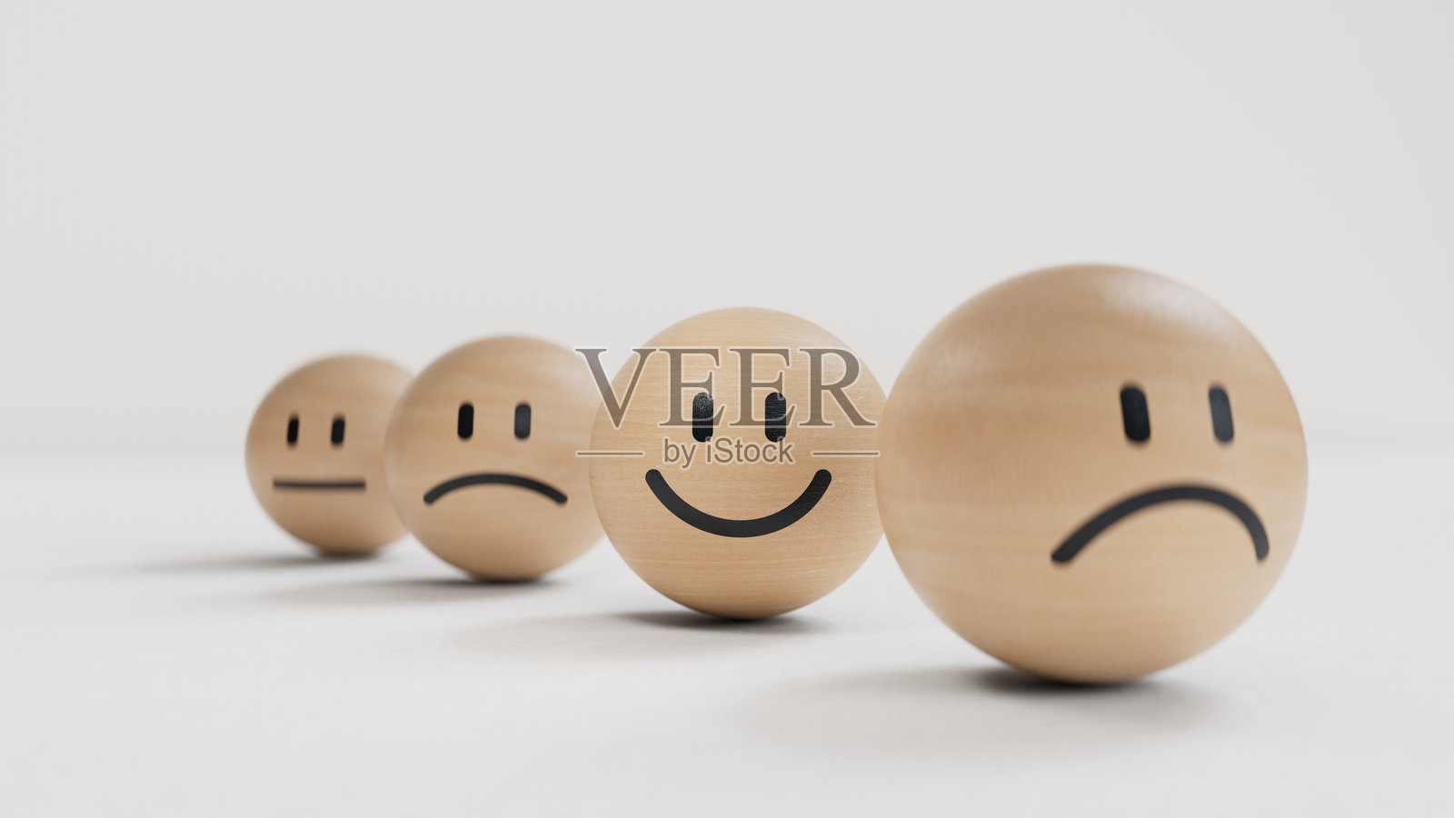 展示不同情绪的小球。木制立方体上有微笑、正常和悲伤的面孔。面部表情。心理健康评估。黑色背景上的3D渲染。照片摄影图片