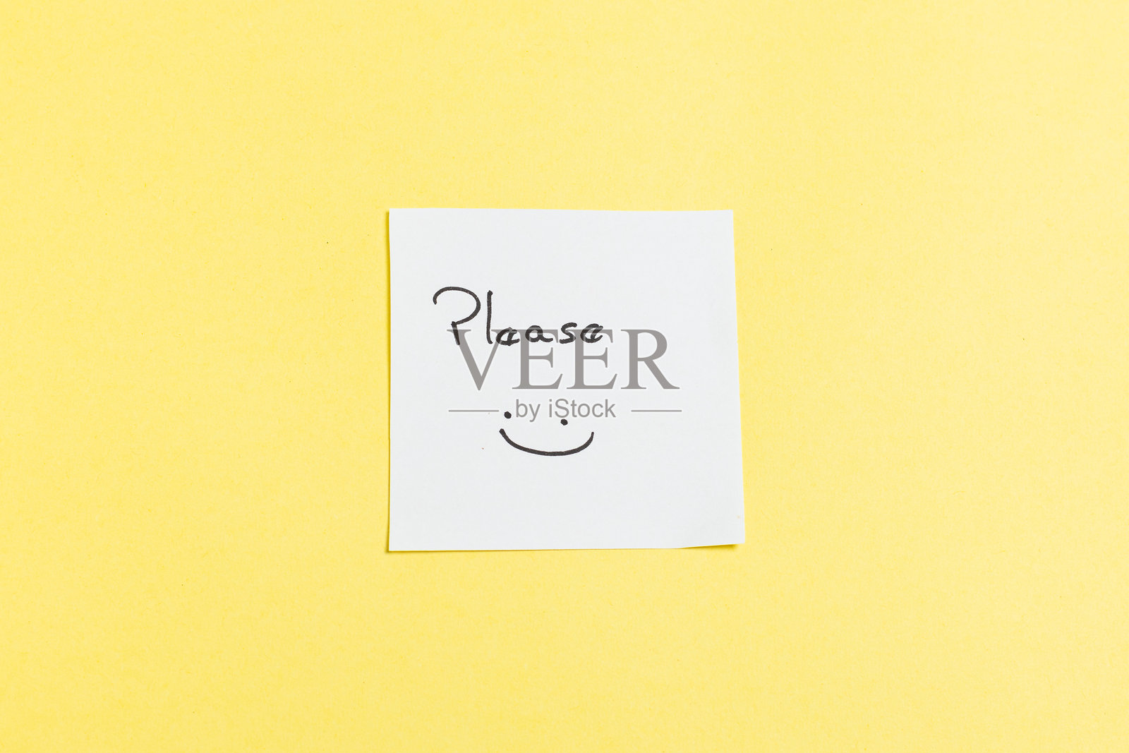 一张画有笑脸的白纸照片摄影图片