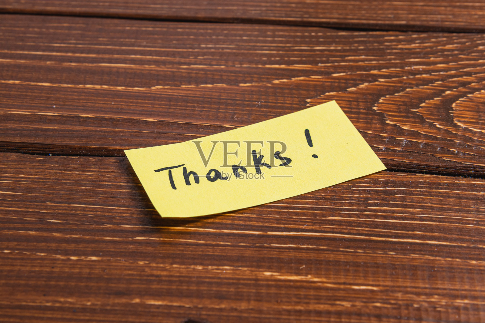 写有“谢谢”的黄色便签纸。照片摄影图片