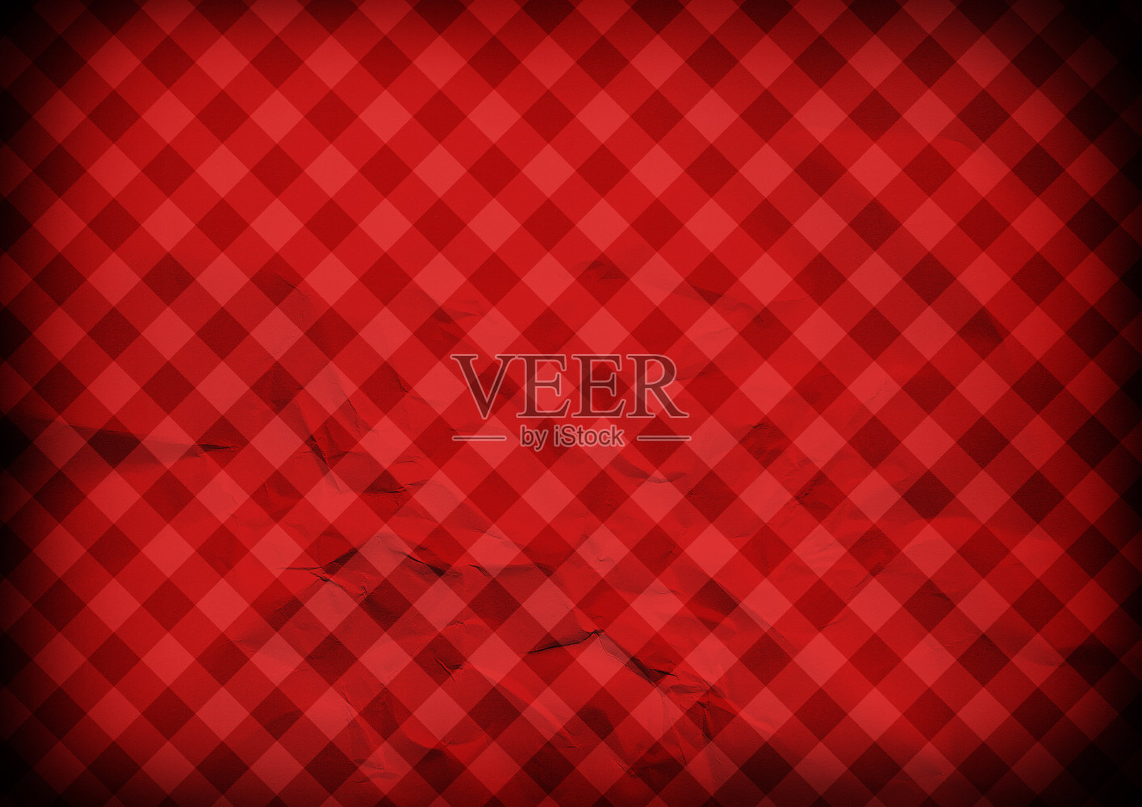 红色皱褶的格子纸背景。照片摄影图片