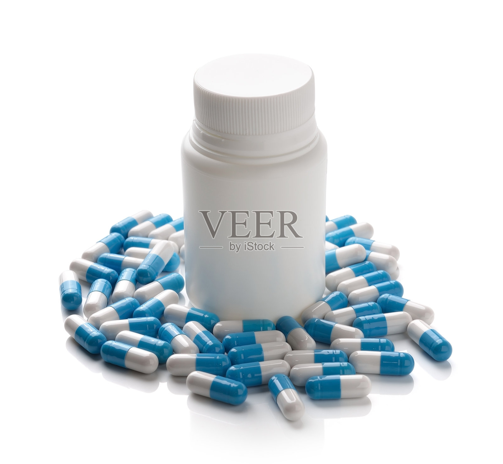 白色背景上的胶囊和药瓶照片摄影图片