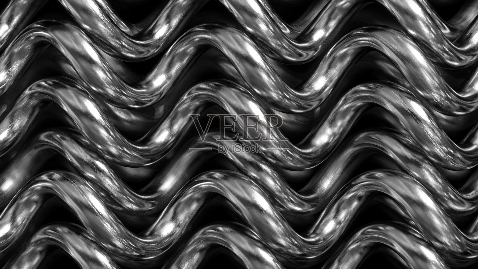 一个带有波浪图案的银色金属物体。这个图案由许多相互连接的小线条组成。物体光滑且具有反射性，展现出现代而流畅的外观。照片摄影图片