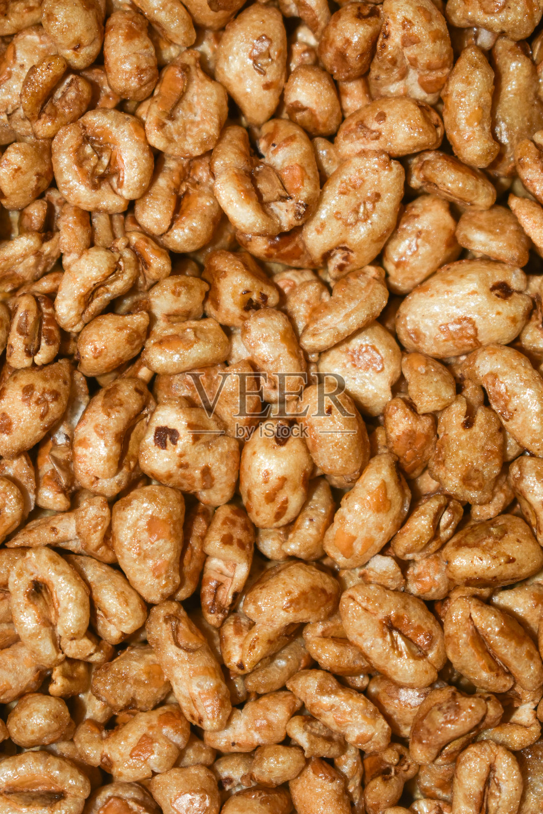 蜂蜜背景纹理的膨化小麦早餐谷物照片摄影图片