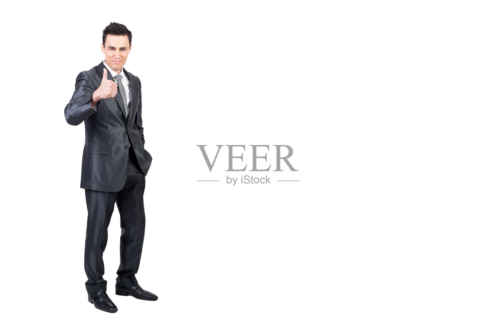 商人在工作室中做出点赞手势。白色背景。照片摄影图片