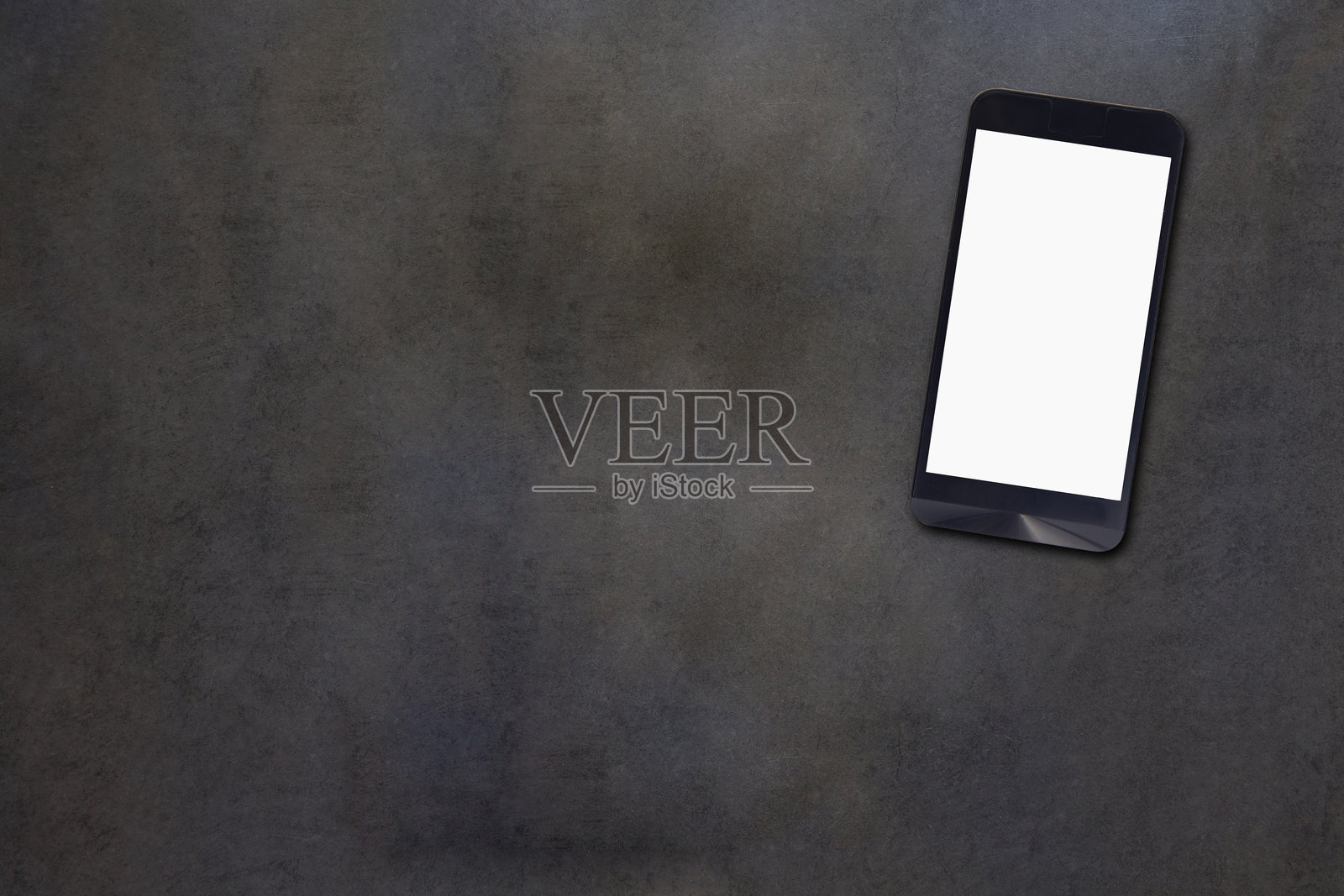 桌子上智能手机的俯视图照片摄影图片