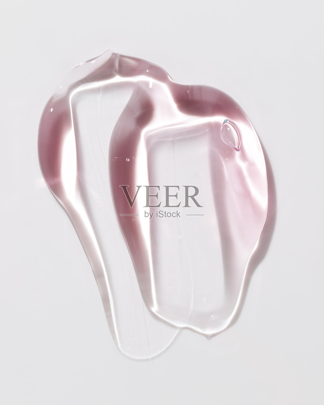 美容凝胶或美容果冻精华的质地背景。粉色透明护肤胶原蛋白产品。照片摄影图片