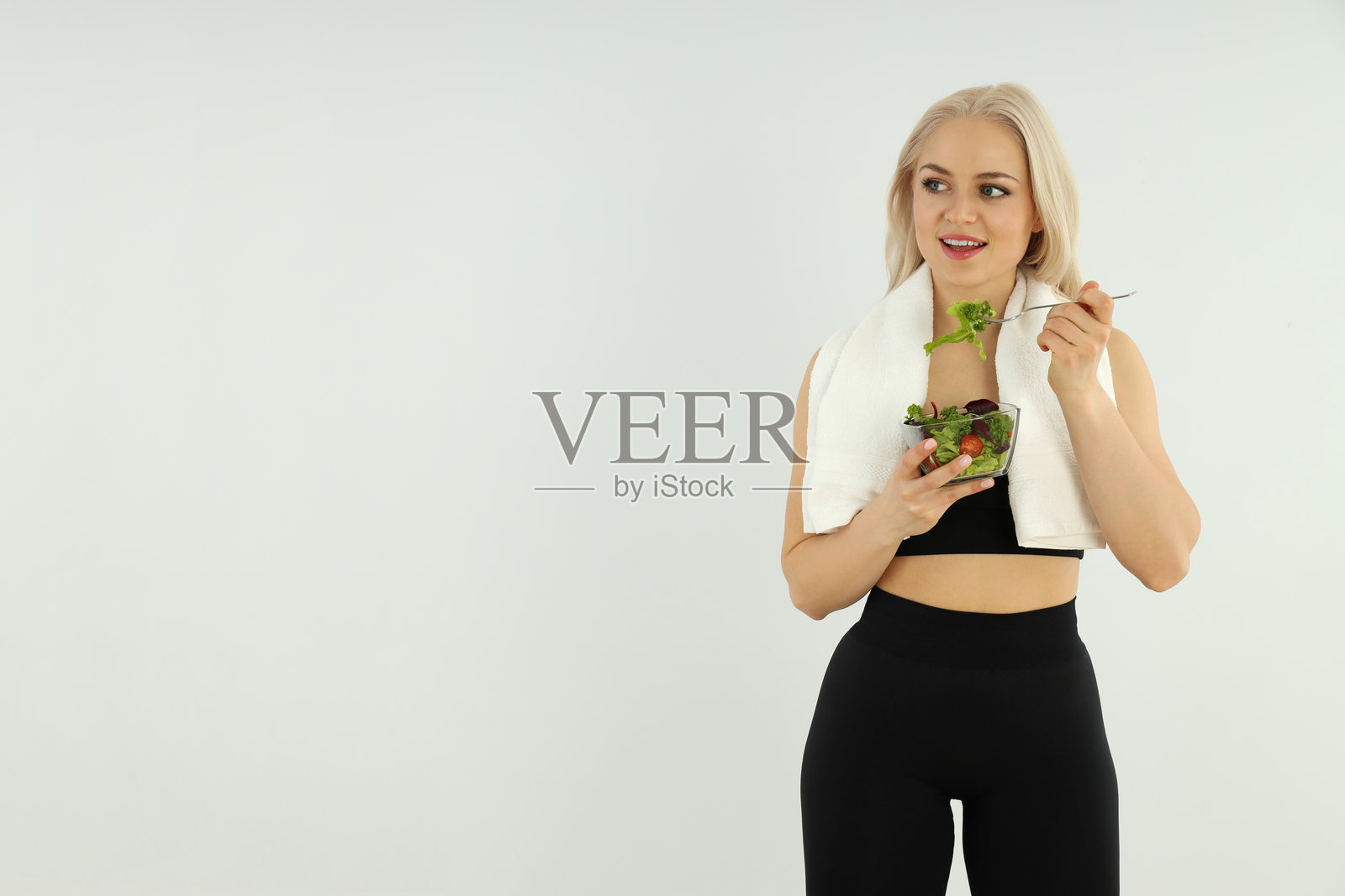 健康生活方式的概念，背景为明亮的运动女性照片摄影图片