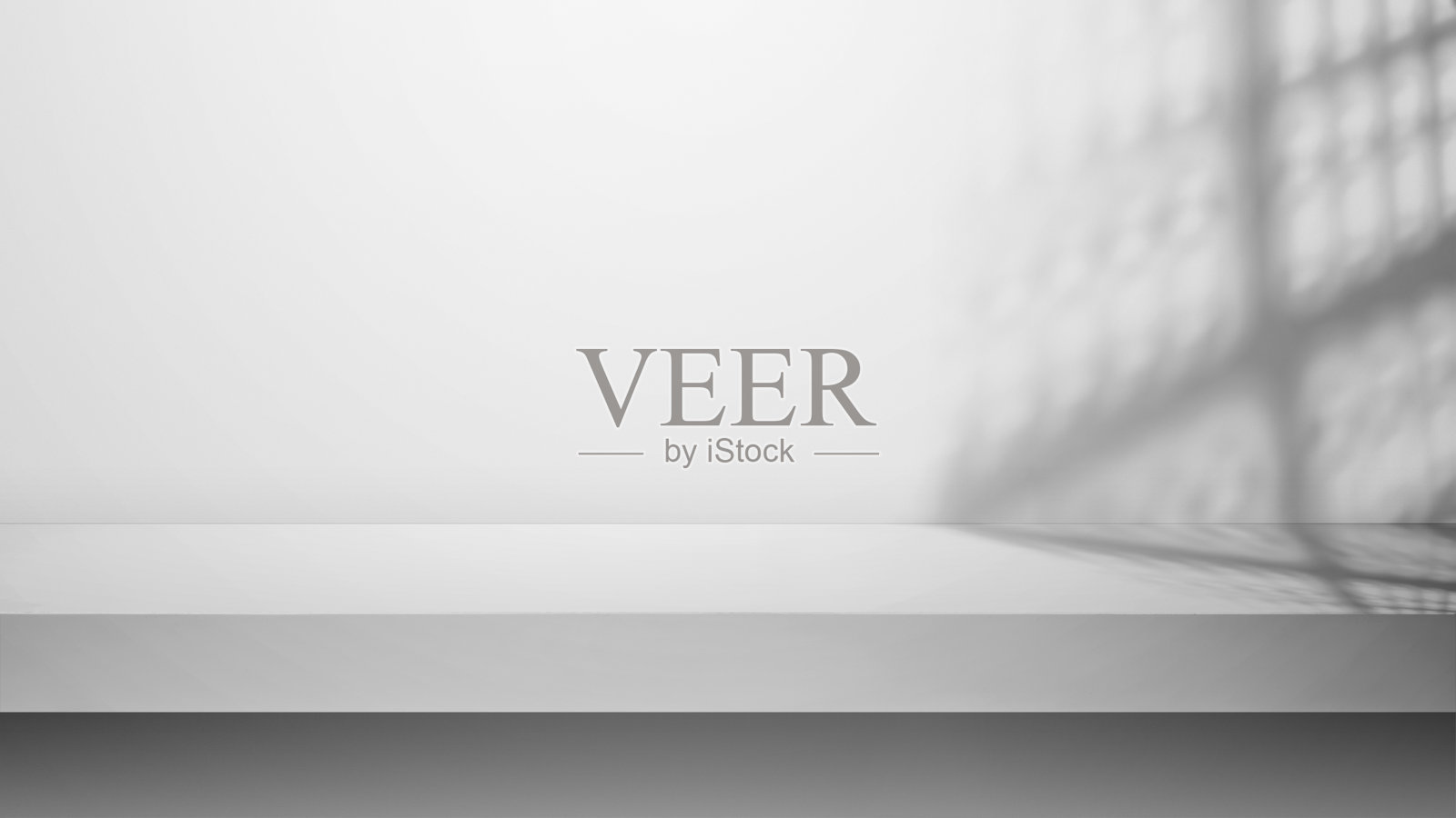 空桌面与白色混凝土墙。混凝土墙的抽象图案照片摄影图片