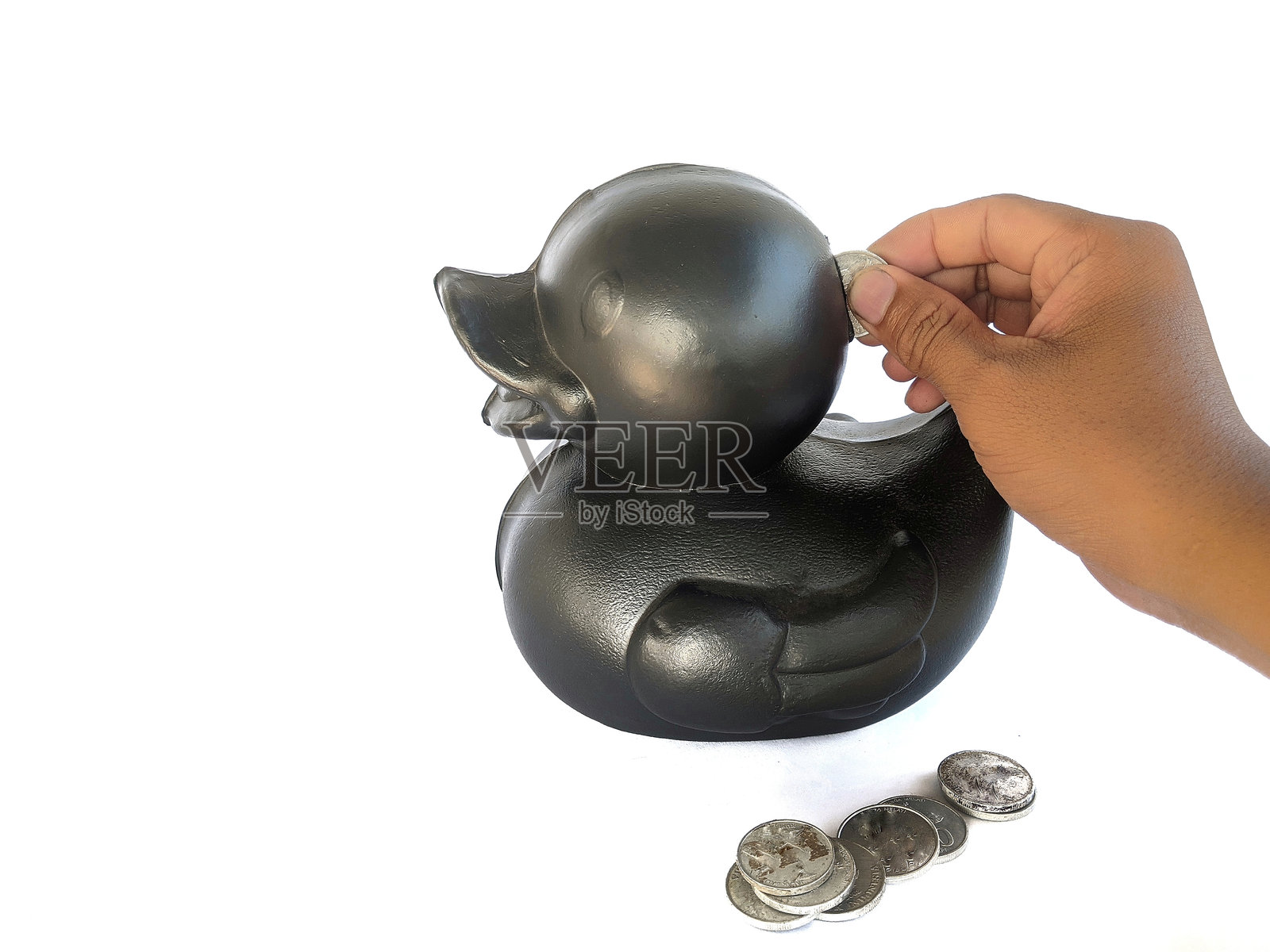 鸭子硬币箱和印尼盾硬币照片摄影图片