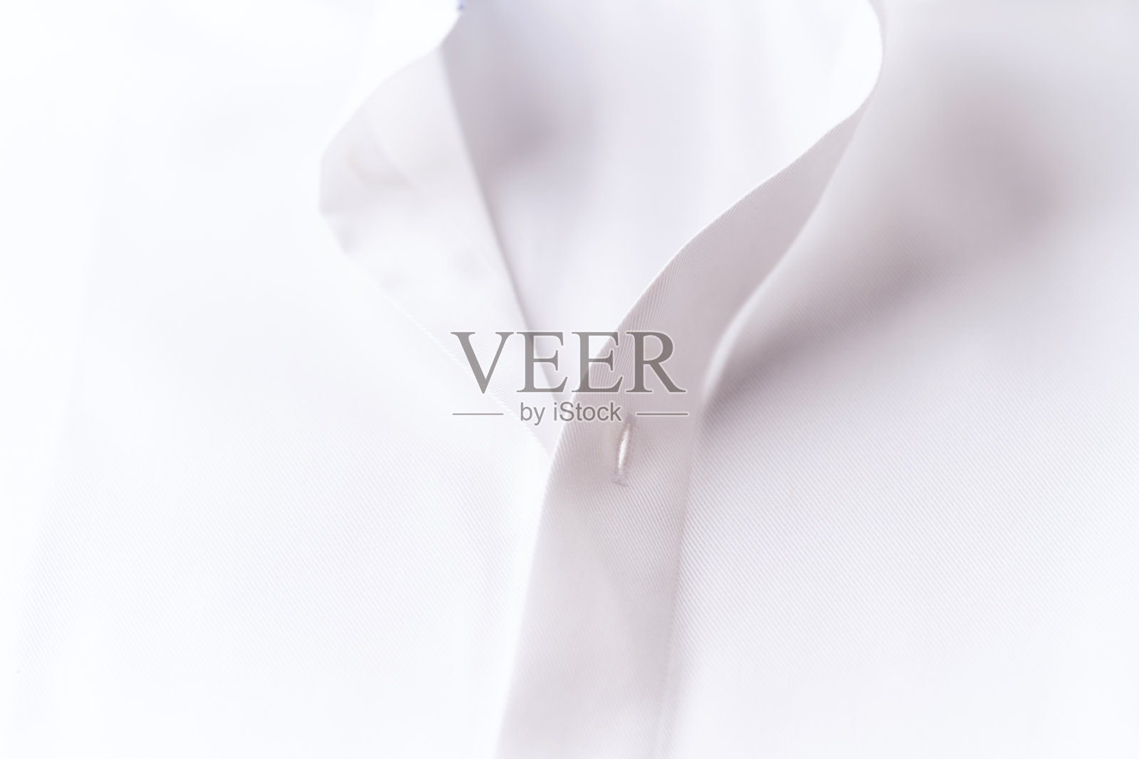 白色男士衬衫的特写镜头。照片摄影图片