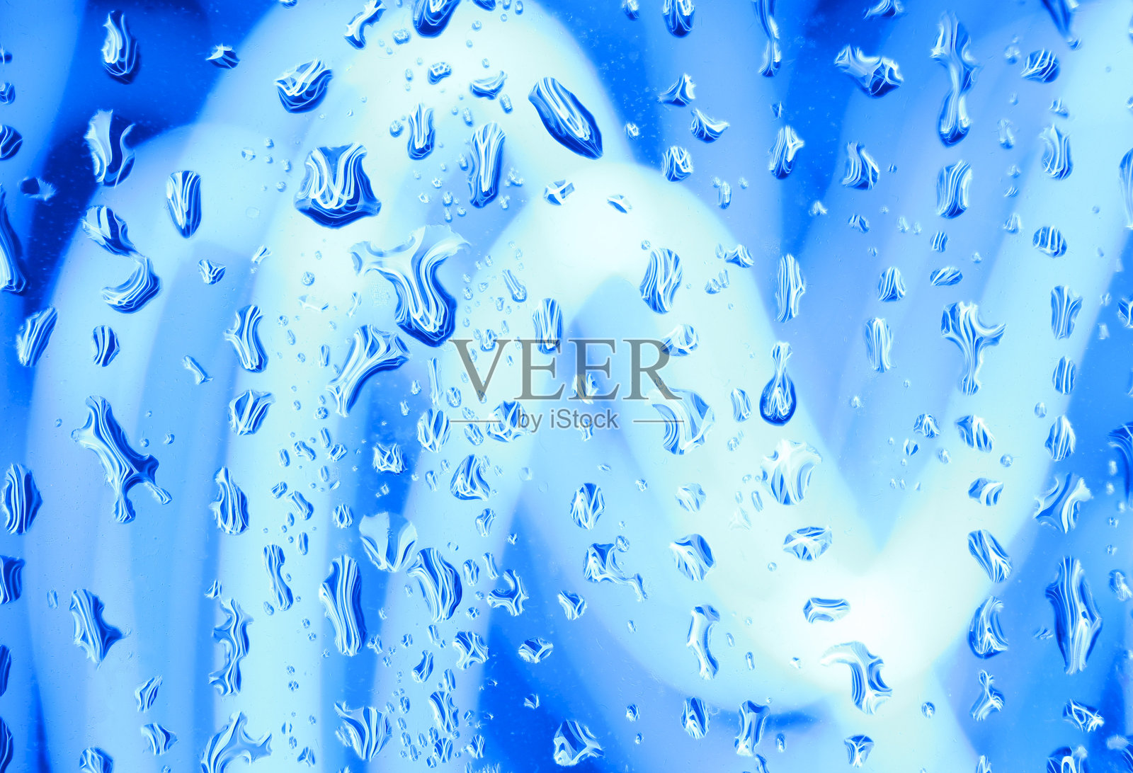 长时间曝光的照片。光绘摄影 - 湿润玻璃后面的五彩缤纷的仙女灯。抽象背景色。照片摄影图片