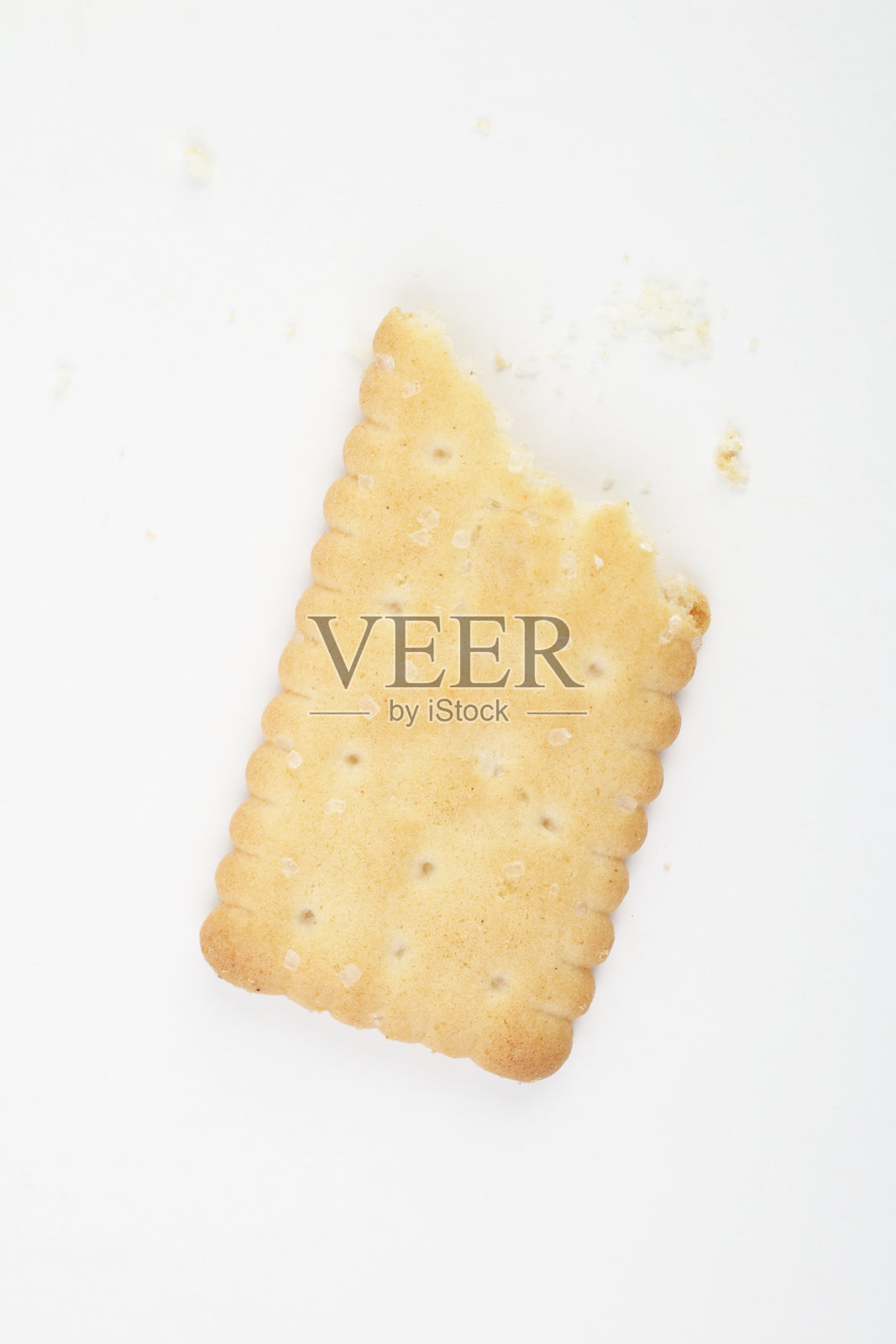 咬了一口的饼干照片摄影图片