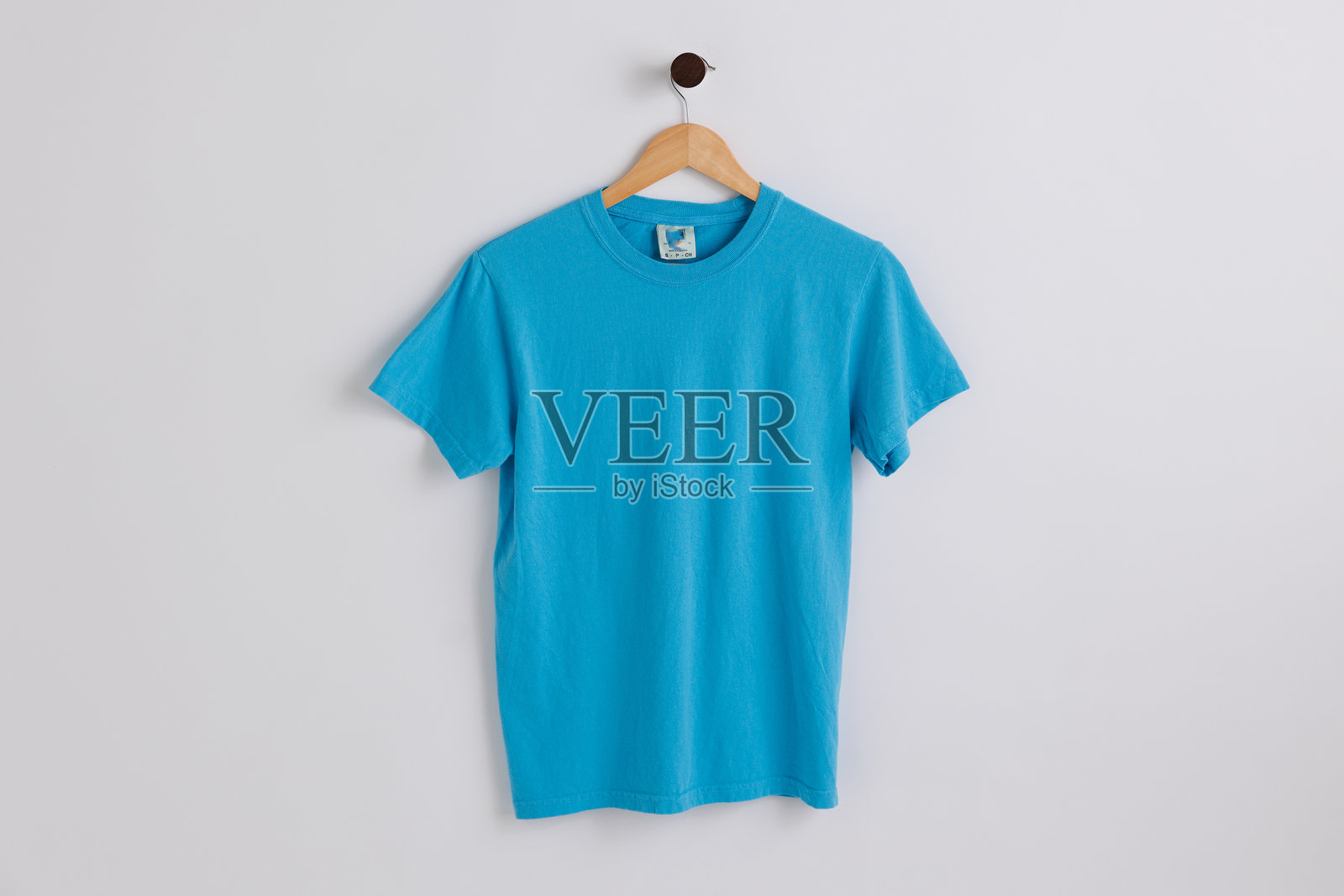 平铺的棉质男女通用T恤样品照片摄影图片