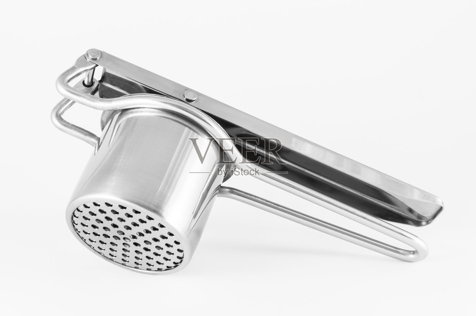 白色背景下的金属榨汁机特写照片摄影图片