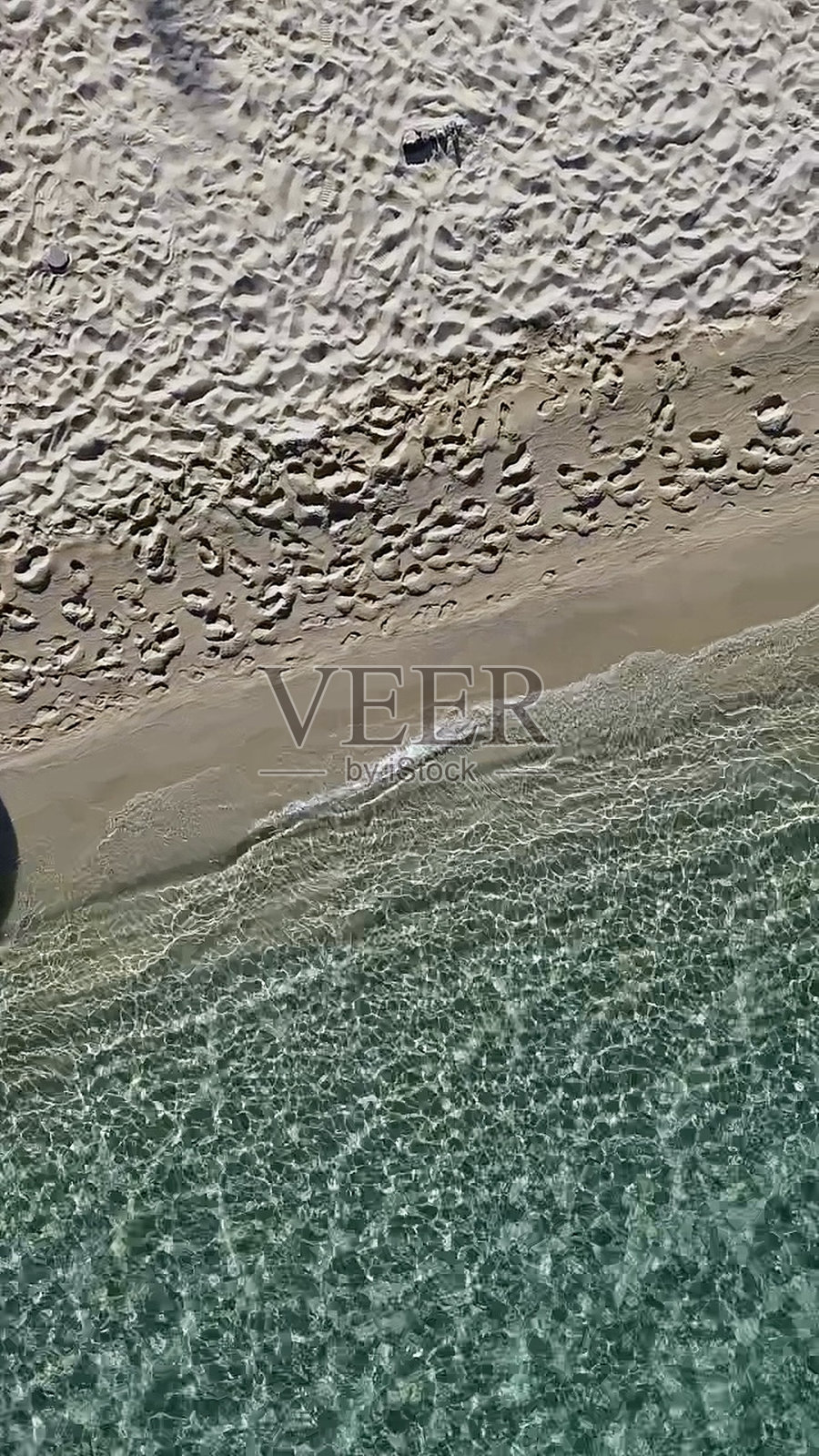 沙滩上的脚印照片摄影图片