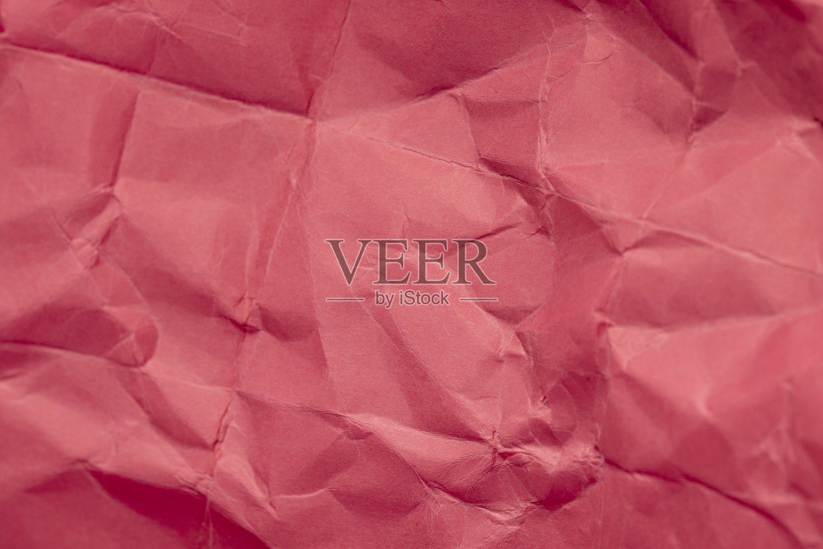 皱褶严重的红色纸张作为背景照片摄影图片