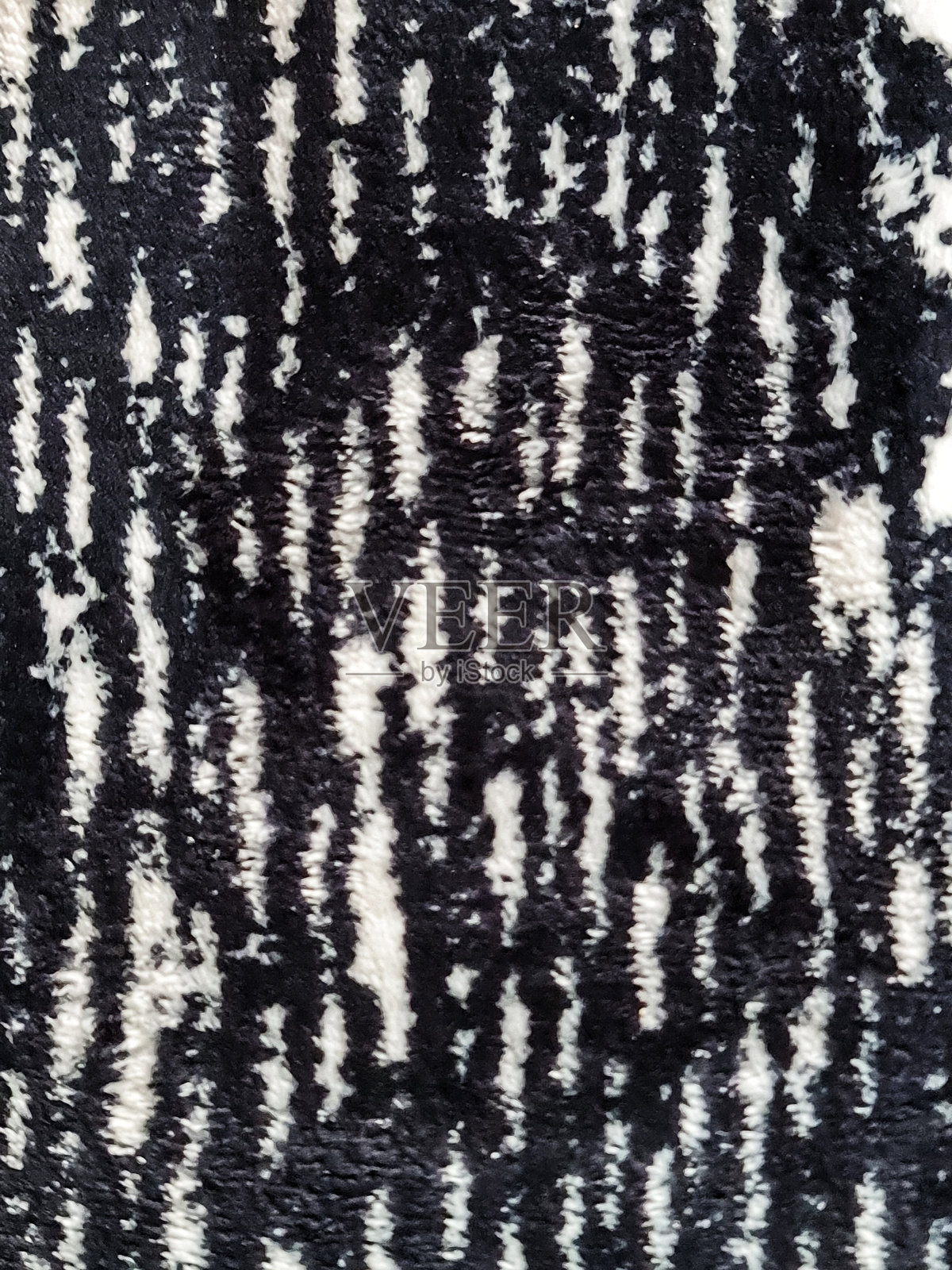 填充框架的照片，地毯图案特写。柔软的毛绒地毯。适合您的家。照片摄影图片