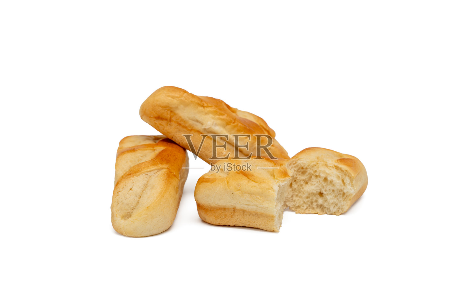 牛奶包的特写，其中一个被切成两半。照片摄影图片