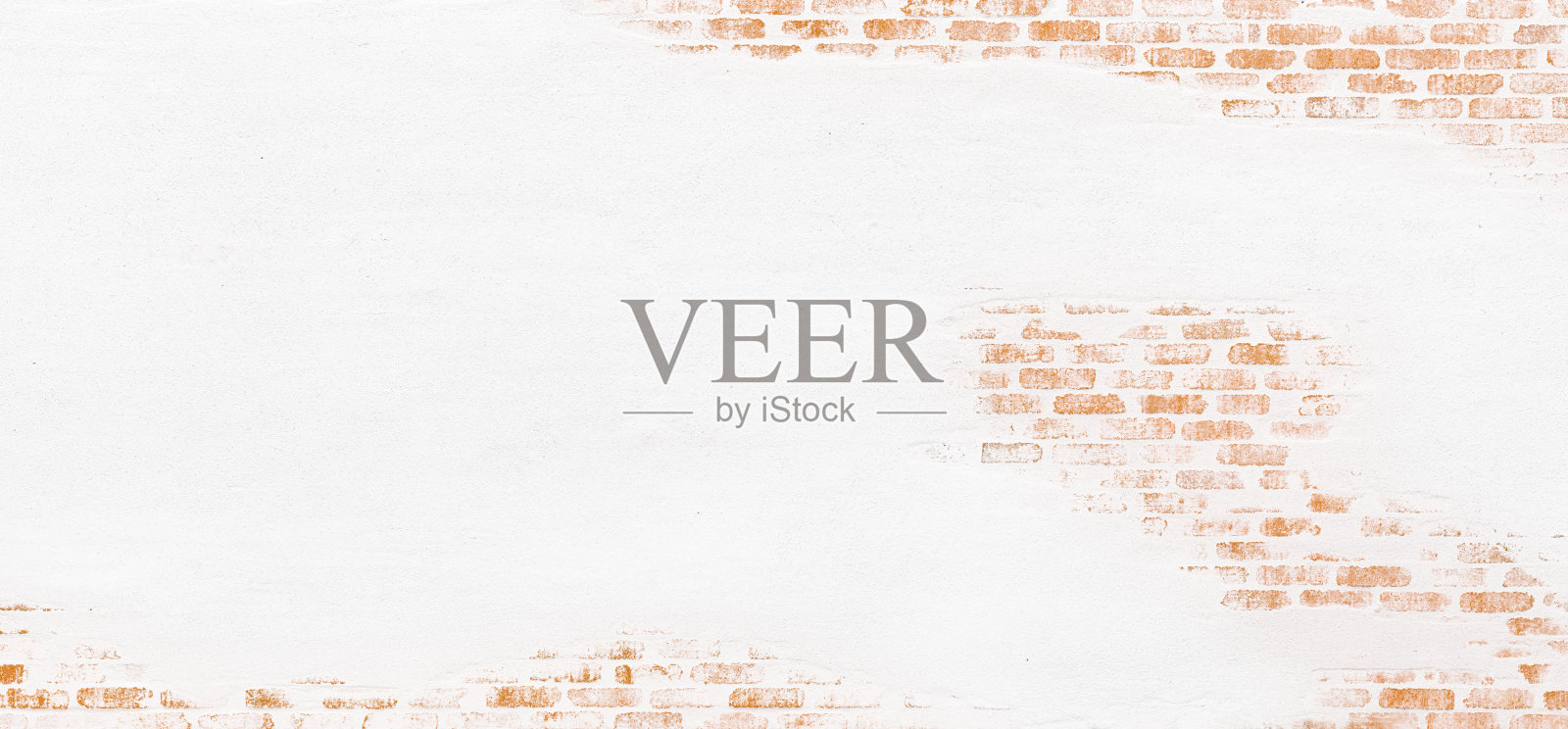 砖墙上覆盖着剥落的灰泥，白色的抹灰层正在剥落。照片摄影图片