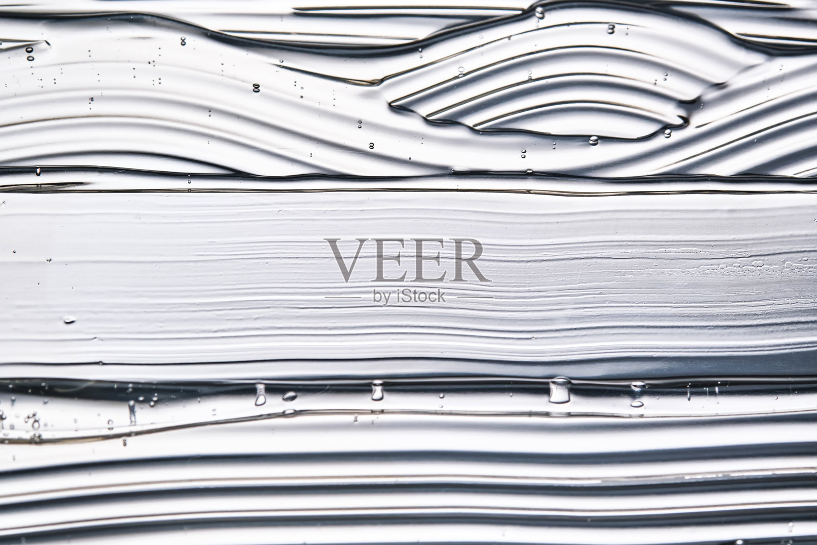 发胶或面部透明质酸凝胶的质地。照片摄影图片