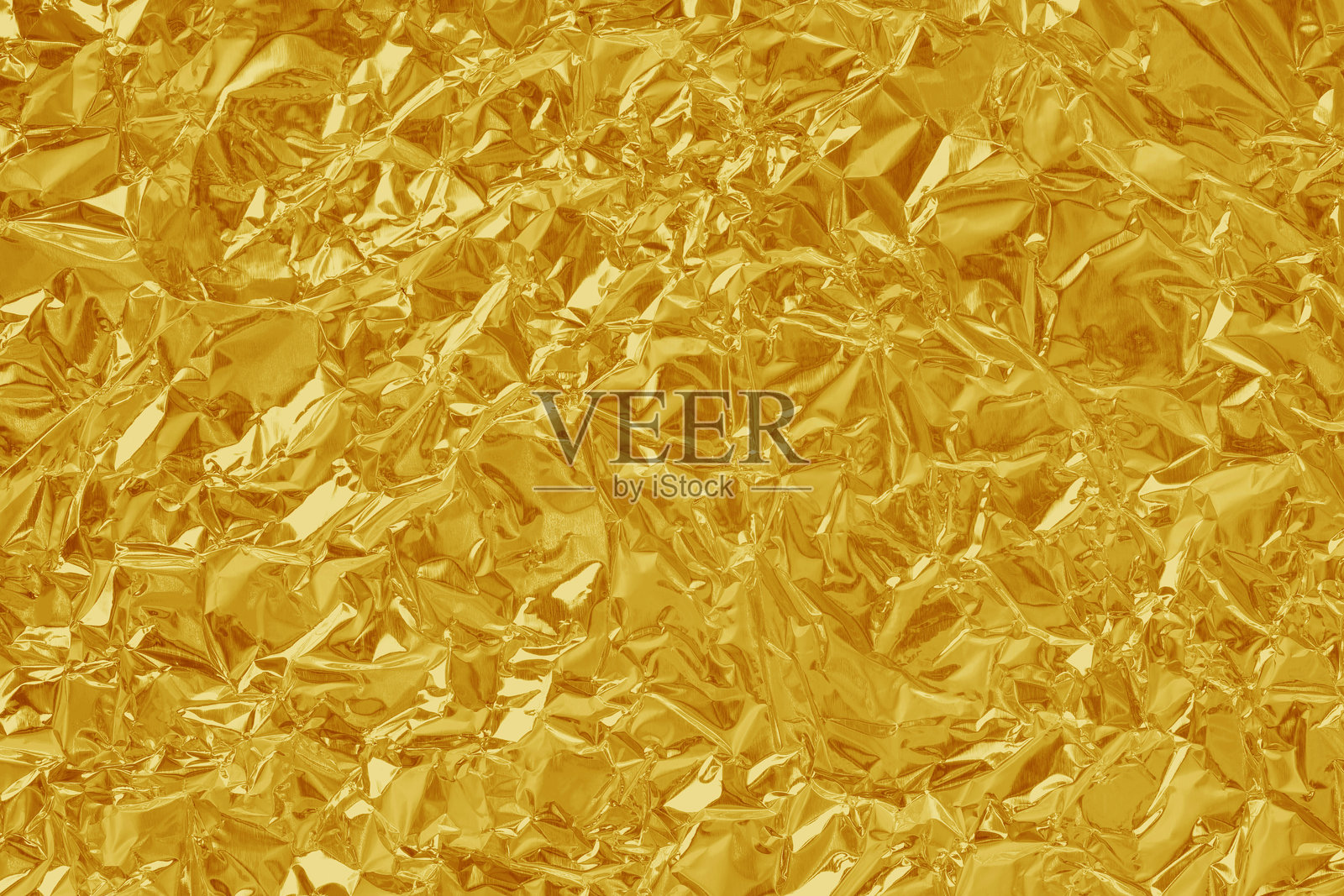 金箔叶光泽质感，抽象的黄色包装纸背景和设计艺术作品。照片摄影图片