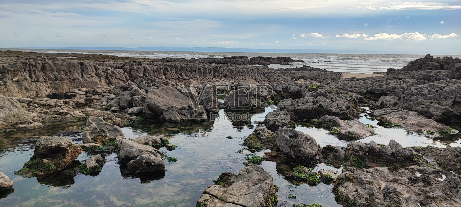 波斯考尔镇海滩壮丽的岩石池照片摄影图片