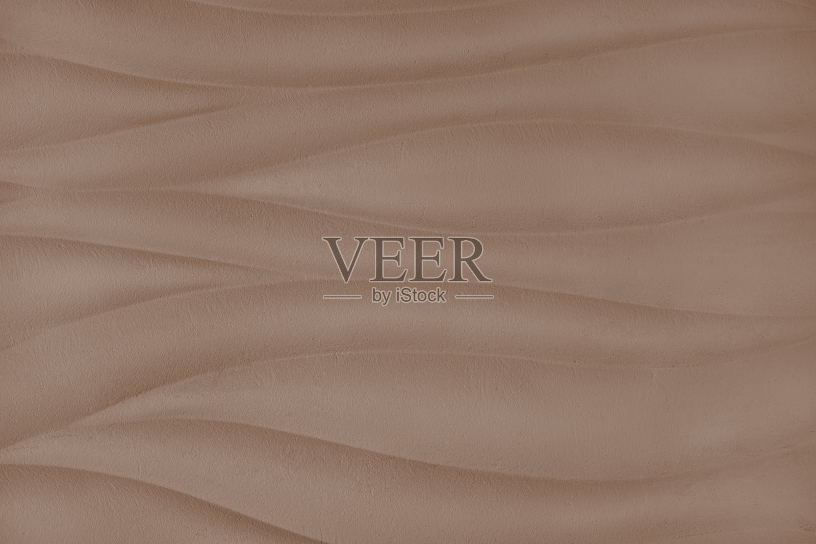 波浪形图案的浮雕表面石膏墙，棕色石膏纹理面板。照片摄影图片