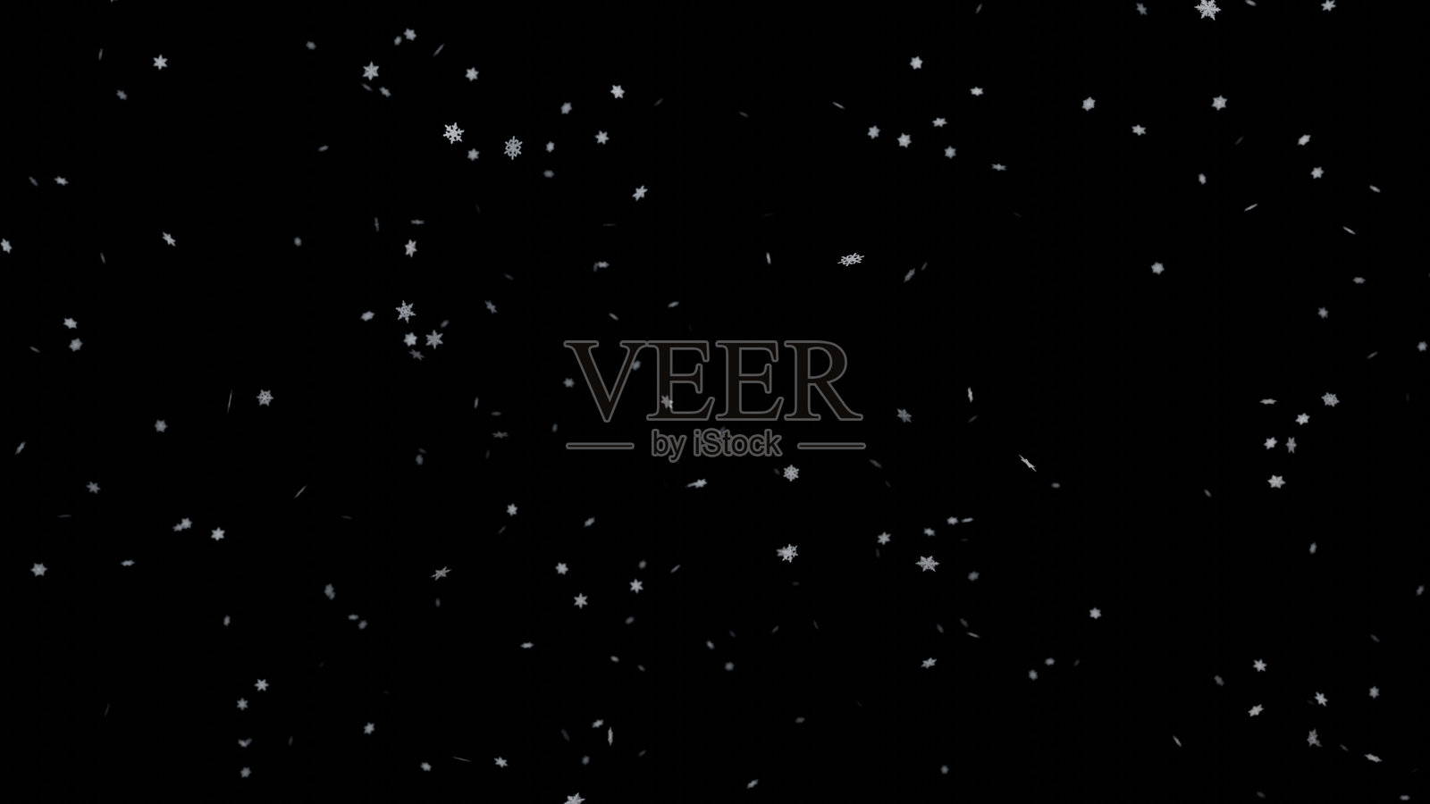 黑色背景上的雪花飘落。黑色背景上的降雪。照片摄影图片