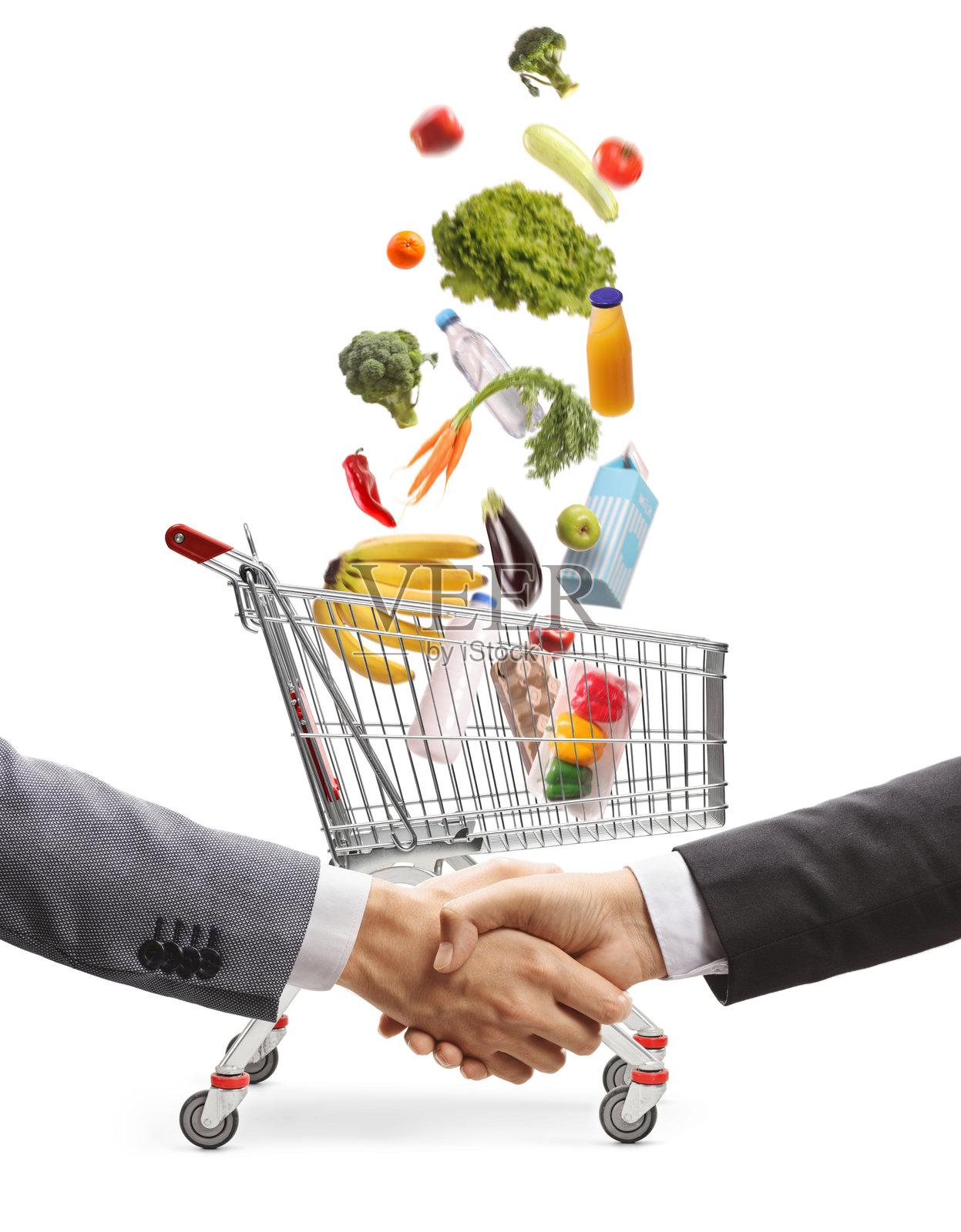 商人在购物车前握手，购物车里的食品掉落。照片摄影图片
