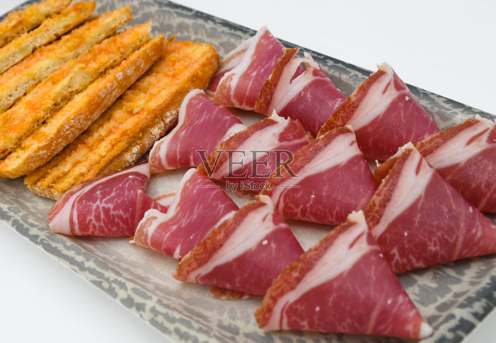 一块优质的伊比利亚风干火腿照片摄影图片