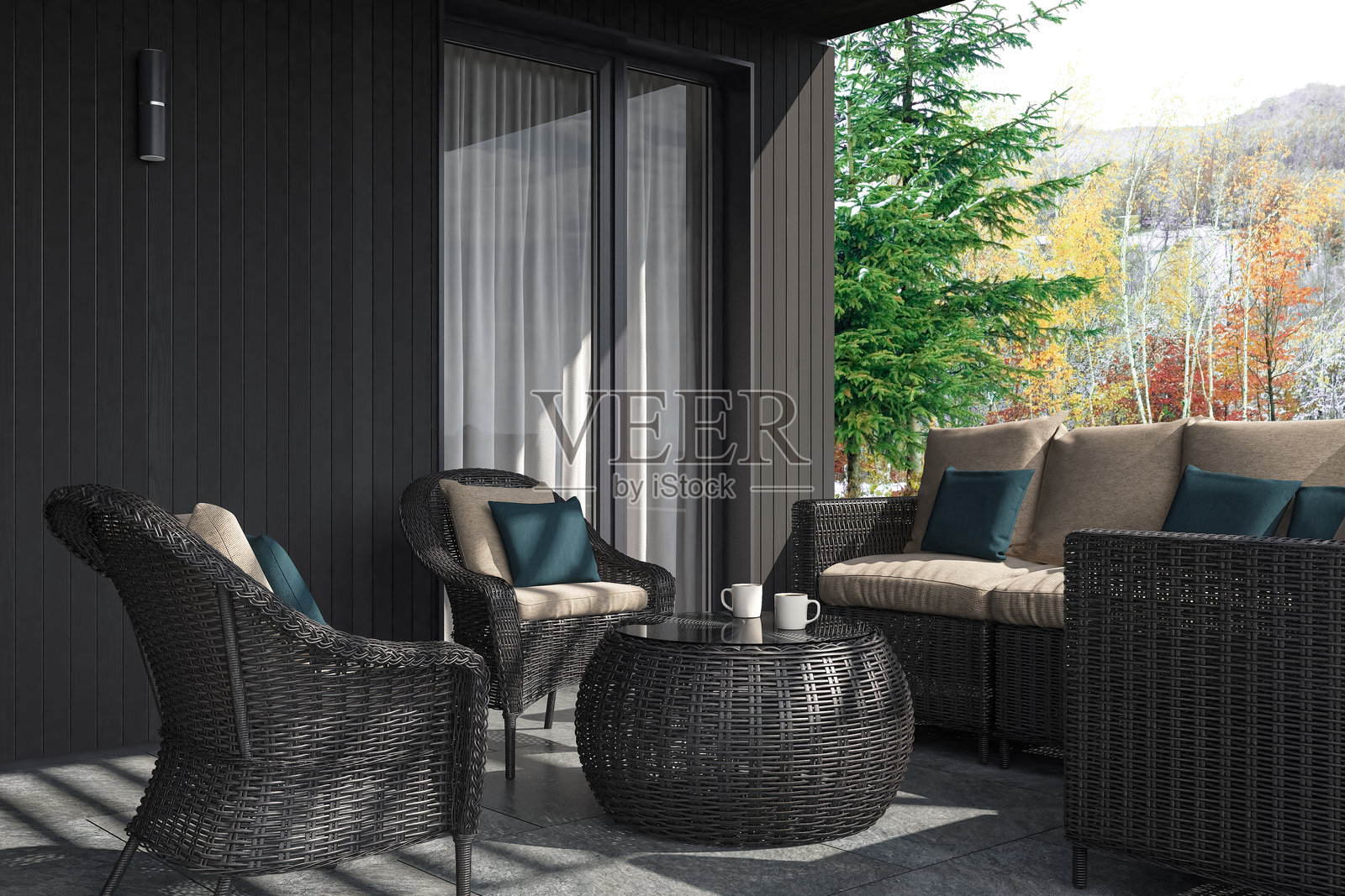 冬季现代别墅露台，黑色木质墙板和藤制家具照片摄影图片