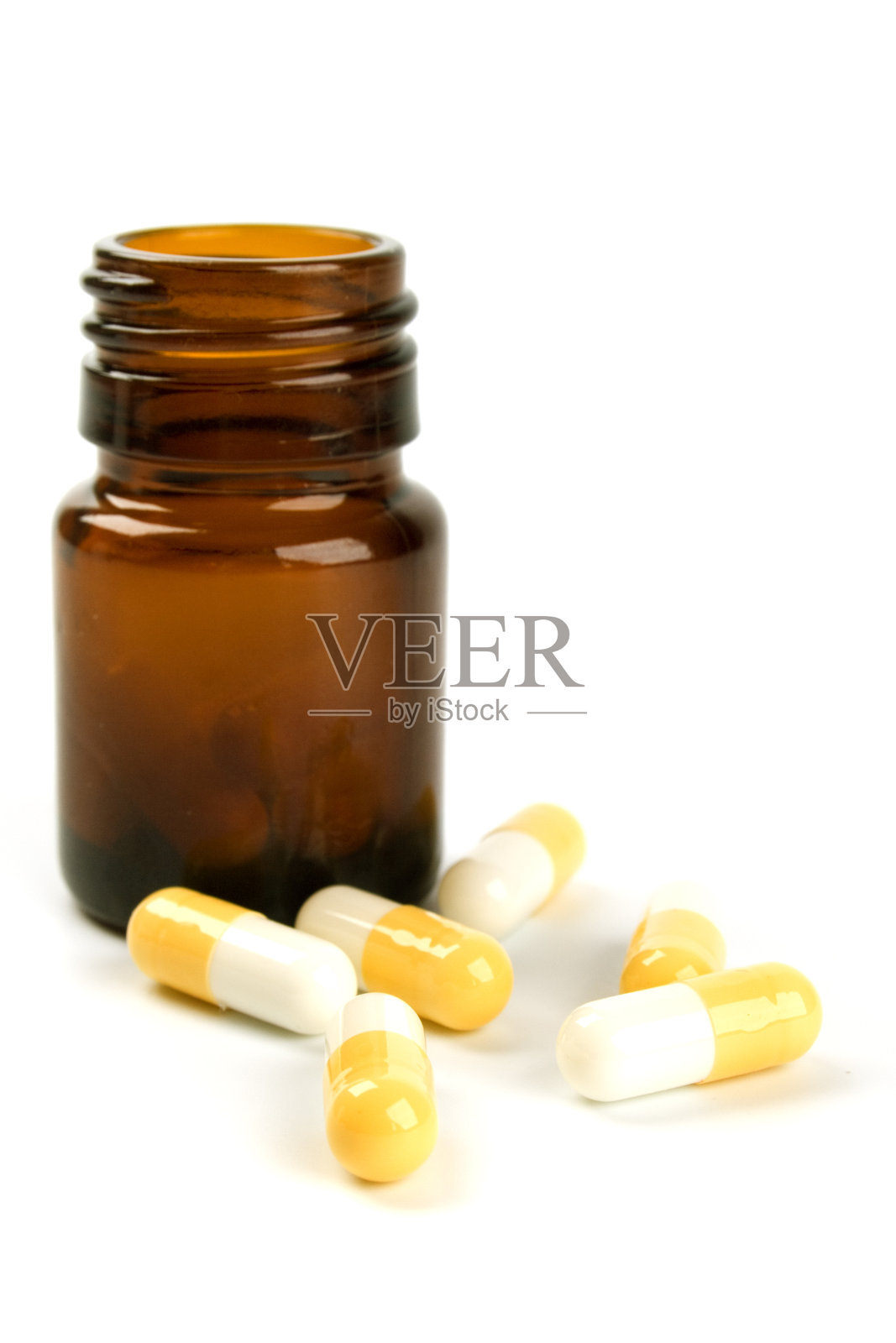 黑色背景下的胶囊特写与瓶子照片摄影图片