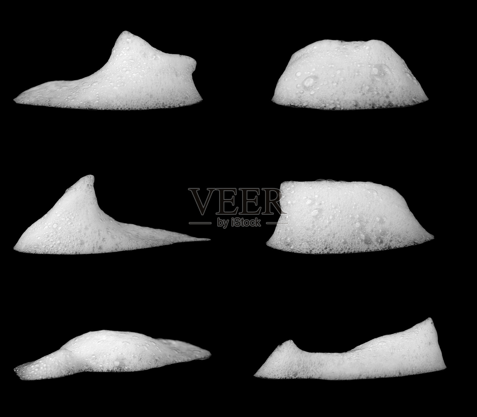 一组白色肥皂泡，洗发水或沐浴露，孤立在黑色背景上。纹理和对比背景。泡沫纹理的概念。浴缸中的肥皂泡。剃须泡沫凝胶。浴泡。照片摄影图片